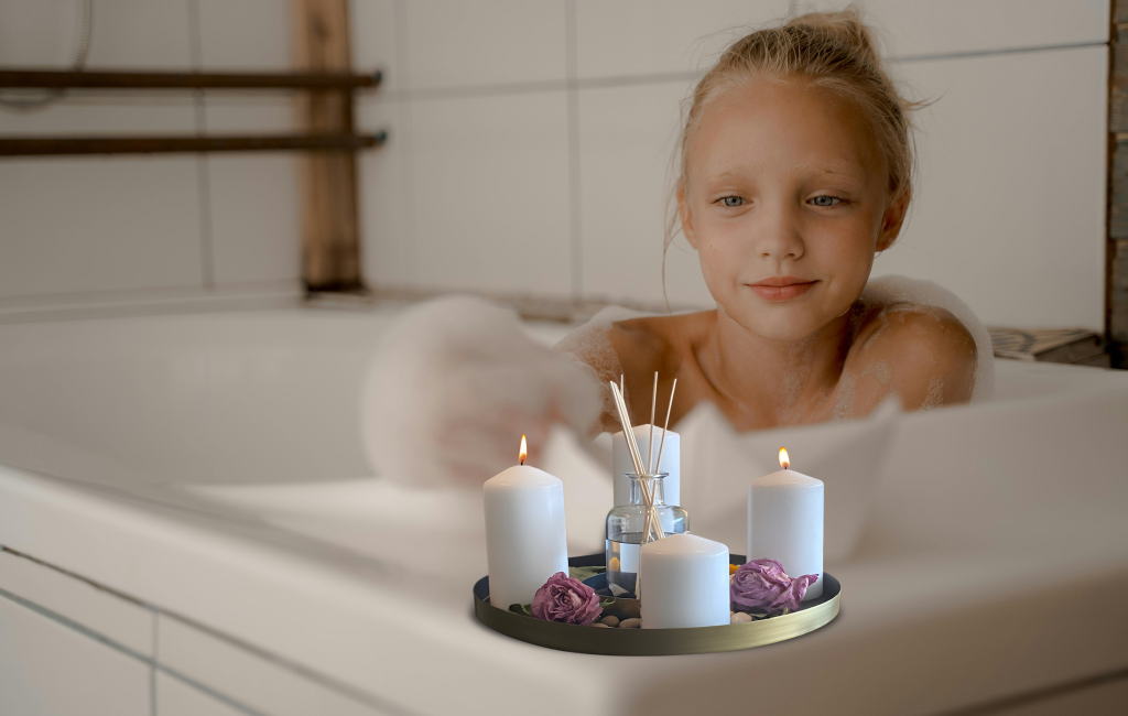 A child taking a bath with candles in a candle plate